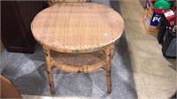 Two tear round wicker table, shows good age, 21 x