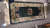 Chinese runner rug with a green background, 24 x