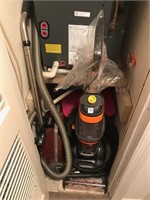Rug cleaner and vacumn in hall closet