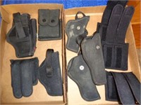2 Boxes of Holsters & Ammo Clip Holders