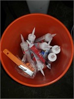 Bucket of silicone and gun