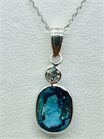 14K White gold bezel set oval mix cut blue zircon