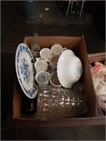 Box of coffee cups large glass vase and