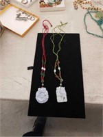 Pair of Asian    Necklaces with pendants