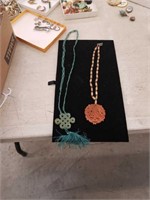 Pair of Asian necklaces with pendants