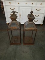 Pair of old candle lanterns with some missing