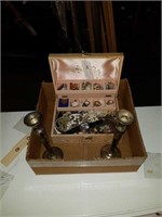box of jewelry and sterling candle holders