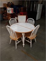 Tile top dining table with 4 chairs and one