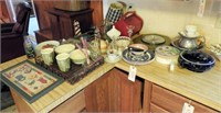 Contents of kitchen countertop: clock, milk glass