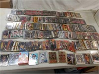 100's NBA basketball cards in plastic sleeves