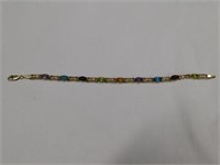 14K y.g. 7" bracelet w/  garnet, amethyst, blue