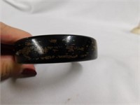 Black bakelite bangle bracelet w/some design?