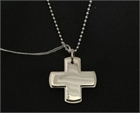 20" STAINLESS STAIN CROSS PENDANT ON TOILET