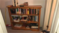 Wooden bookshelf with contents