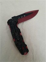 New pocket knife with red and black blade