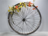 Floral decorated bicycle wheel art
