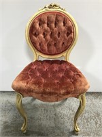 Carved wood quilted upholstered chair