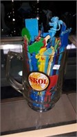 Collectors swizzle sticks in Skol Lager beer mug