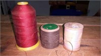 2 vintage wooden spools and one spool of thread