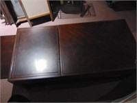 ROLLING DARK WOODEN COFFEE TABLE, WITH RISING