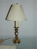 BRASS LOOKING LAMP WITH CREAM COLORED SHADE. 25"