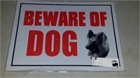 Stack of Beware of dog signs
