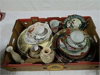 Oriental themed plates, cups and saucers and
