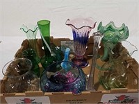 A large assortment of colored glass vases