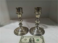Pair of candlesticks both marked Sterling