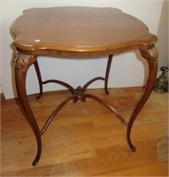 Antique wood table with carved design. Measures