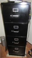 Four drawer metal file cabinet. Measures 52" h x