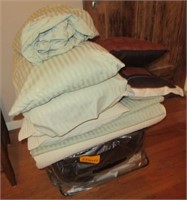Bedding items including pillows, blankets and