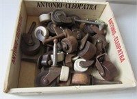 Group of antique wood and ceramic castors.