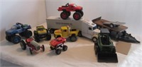 Box of toy trucks and tractors including Buddy L,
