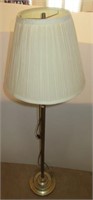 Brass floor lamp with shade. Measures 56.5" tall.