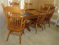 Large oak dining table with three leaves and six