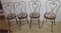 Set of four wrought iron ice cream parlor chairs.