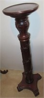 Carved wood plant stand. Measures 41.5" tall.