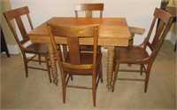 Oak dining table with four chairs. Table measures