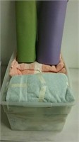 Tub of towels and exercise mats