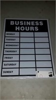 Stack of business hours signs