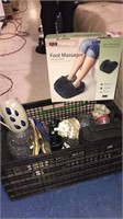 Crate with a foot massager, binoculars,