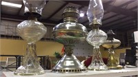 Group of 4 oil lamps, 3 glass and 1 metal one,