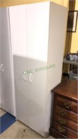 White storage cabinet with two doors and five