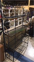 Metal Baker rack with brass accents, has four