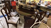 Queen Anne cherry dining table and four chairs,