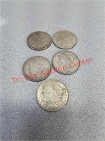 Five 1921 Morgan silver dollars