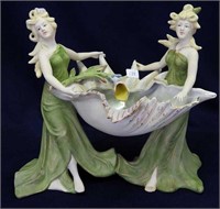 Bisque 9 1/2" high figurine of ladies w/lg shell