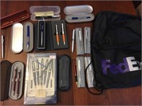FedEx bag filled with pens- some laser pointers ot