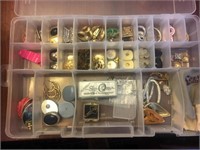 Plastic tray organizer filled with earrings